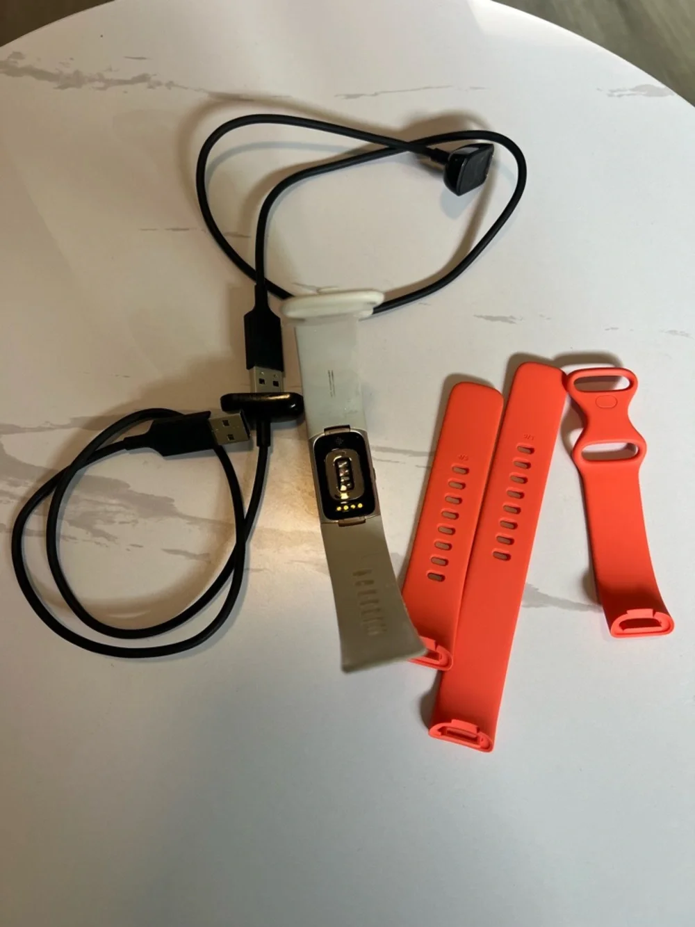 Google Fitbit Charge 6 Color: Coral/Champagne Gold Aluminum White bands Charger